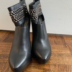 Black studded high heel boots